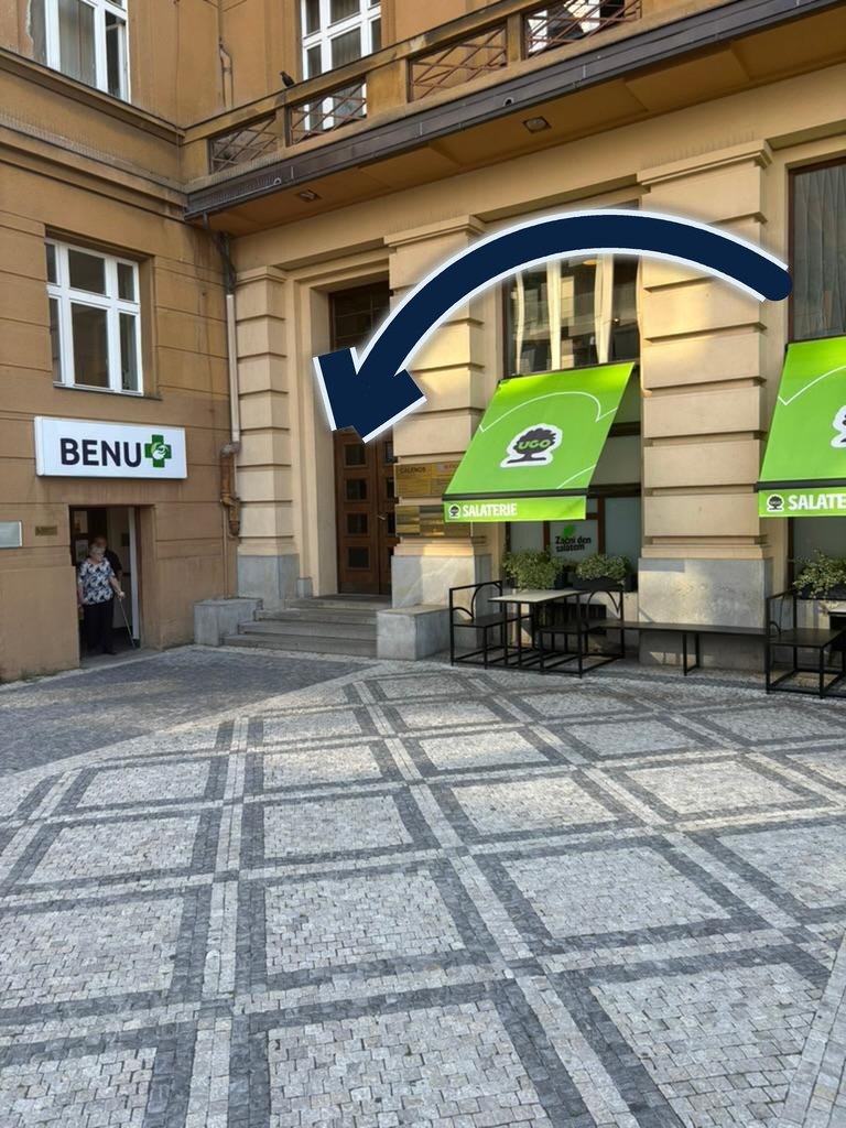 Entrance to the DermatologyExpert clinic building at Vítězné náměstí, next to the BENU pharmacy